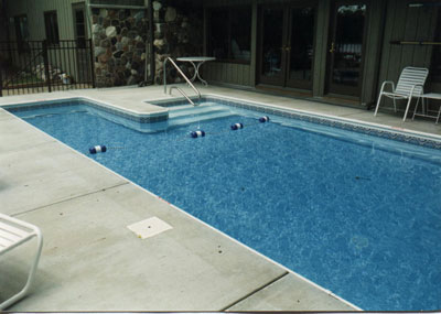 photo of pool and stair entry near house