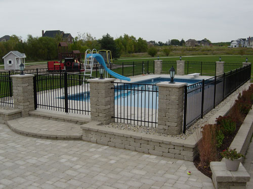photo of pool with stone column fence Yorkville, IL