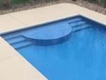 semi circle sundeck with pool stairs